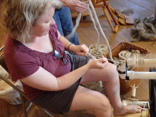 GDMBR: This lady is spinning yarn.
